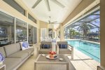 Villa Once Upon a Tide features a large under Truss Lanai Sitting Area